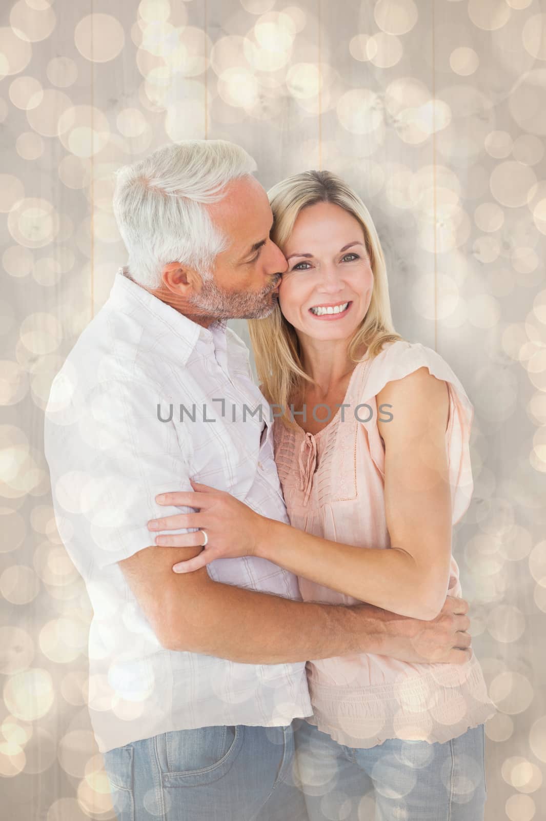 Composite image of affectionate man kissing his wife on the cheek by Wavebreakmedia