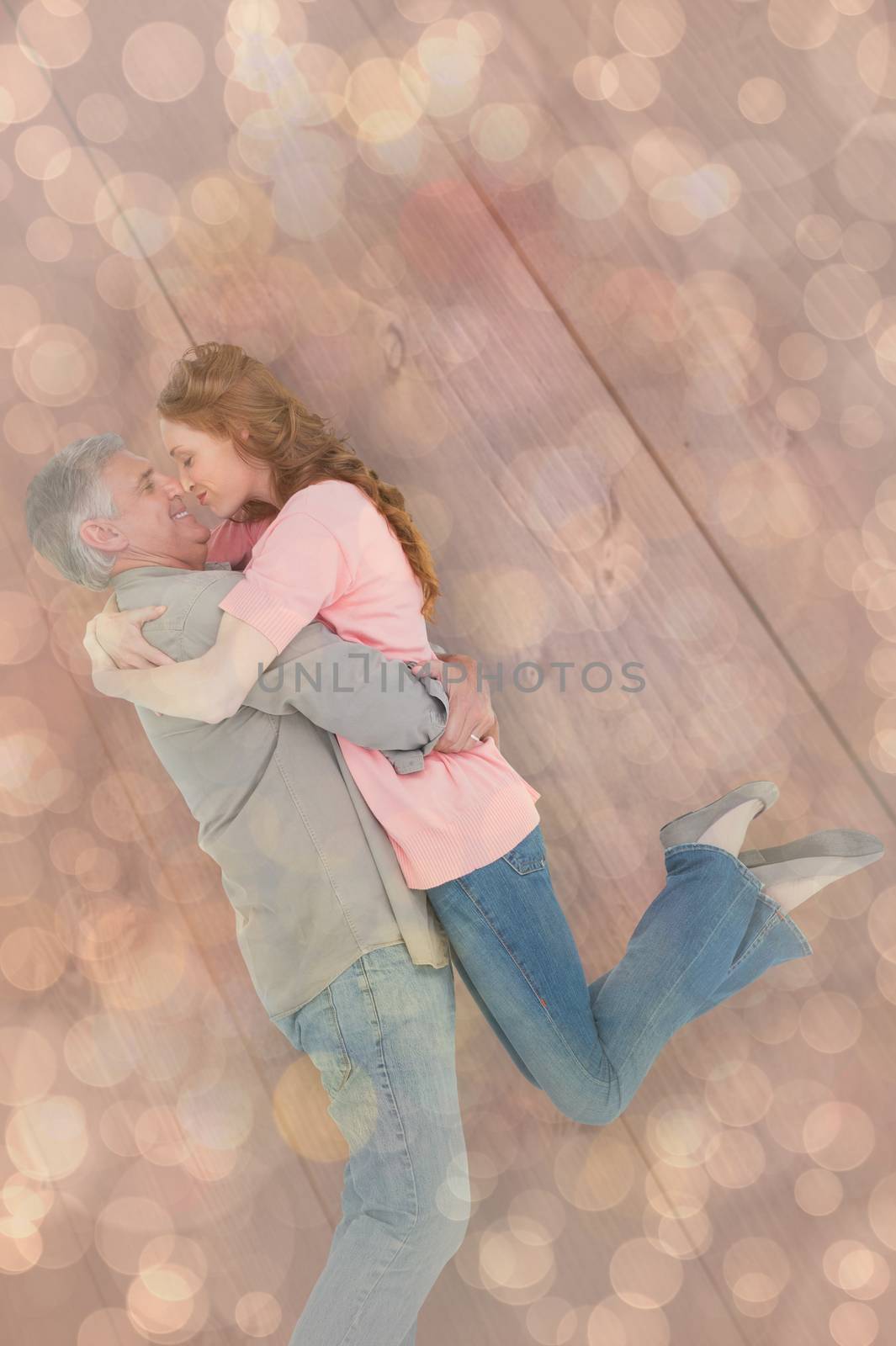 Composite image of casual couple hugging each other by Wavebreakmedia