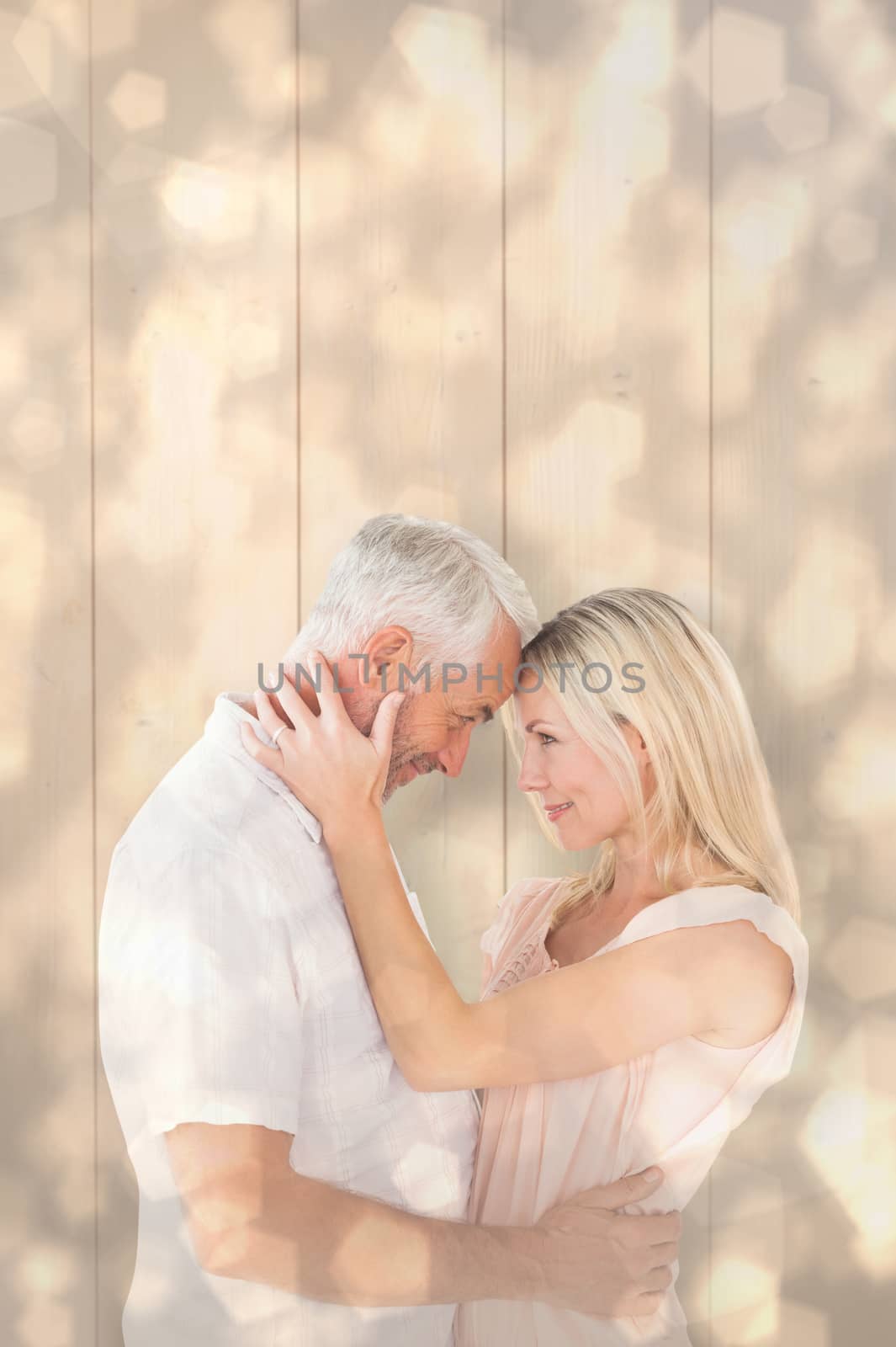 Affectionate couple standing and hugging against light glowing dots design pattern