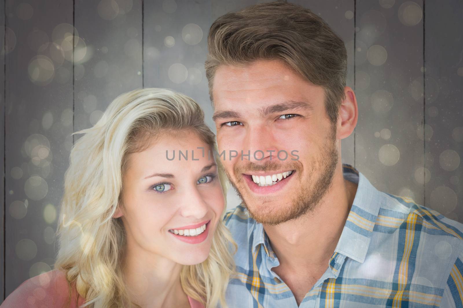 Composite image of attractive young couple smiling at camera by Wavebreakmedia