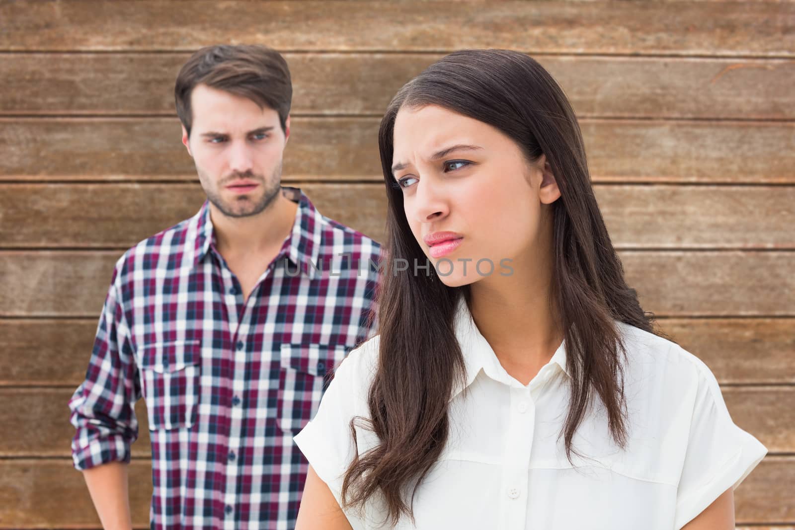 Composite image of angry brunette not listening to her boyfriend by Wavebreakmedia