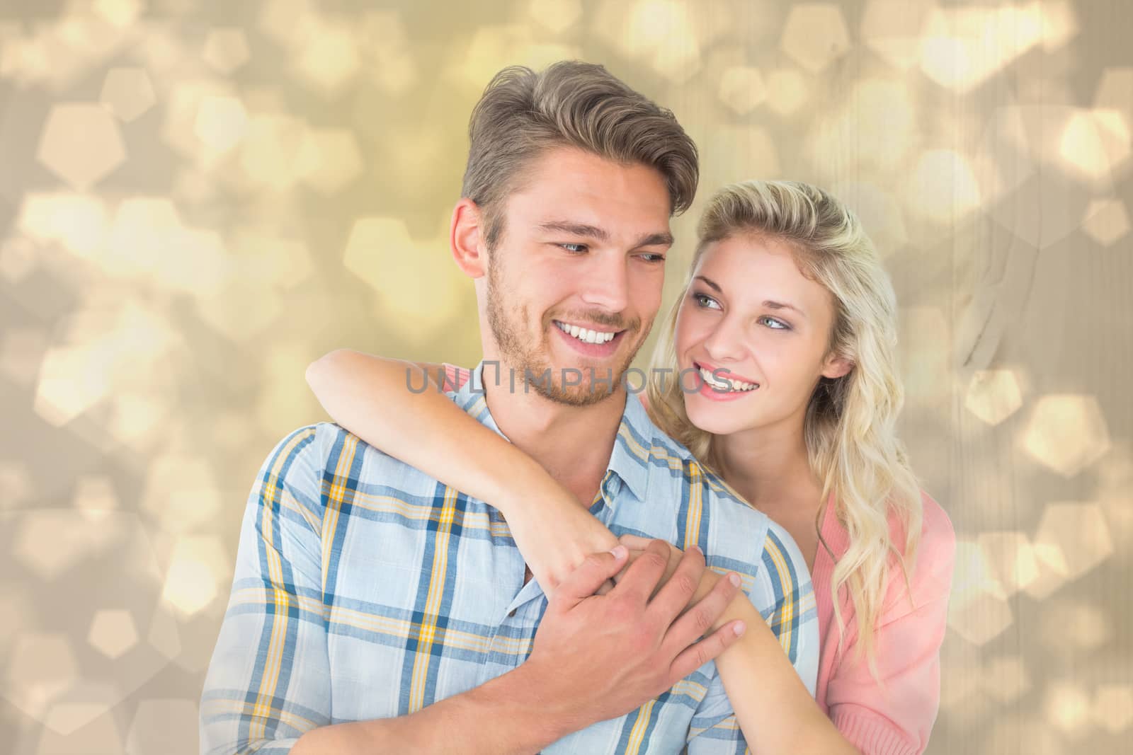 Composite image of attractive couple embracing and smiling by Wavebreakmedia