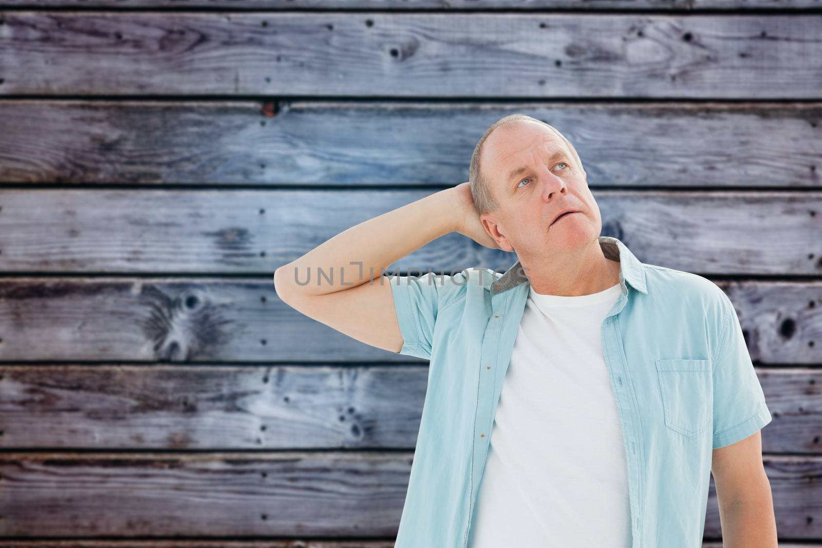 Composite image of thoughtful older man looking up by Wavebreakmedia