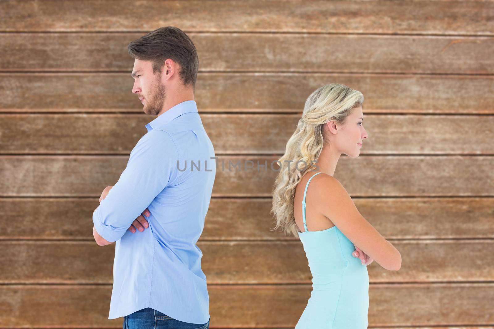 Composite image of unhappy couple not speaking to each other  by Wavebreakmedia