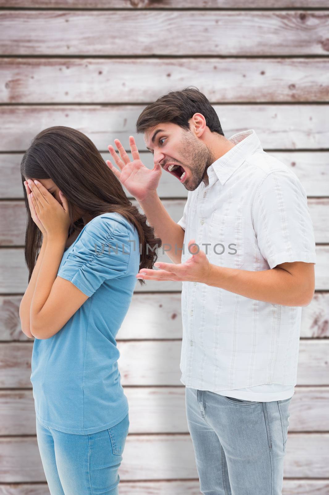 Composite image of angry man shouting at girlfriend by Wavebreakmedia