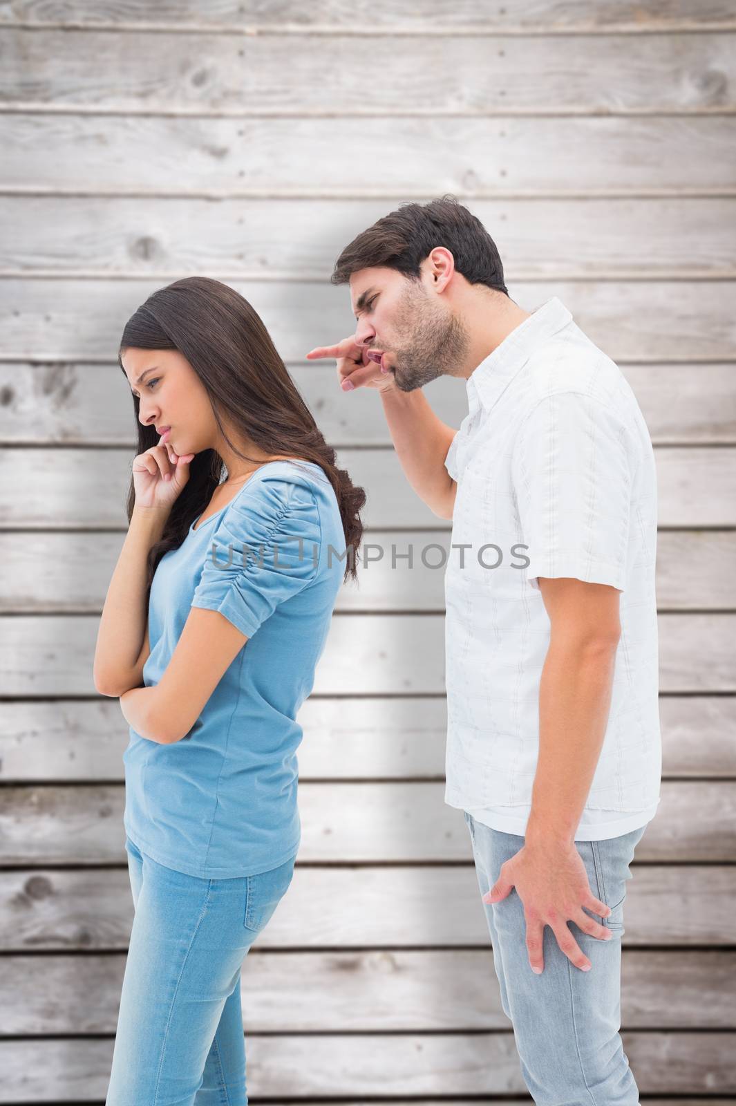 Composite image of angry man shouting at girlfriend by Wavebreakmedia