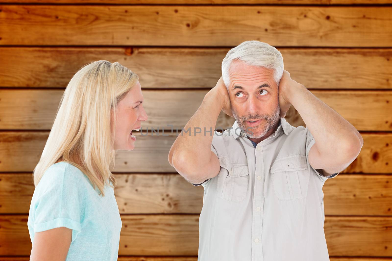 Composite image of unhappy couple having an argument with man not listening by Wavebreakmedia