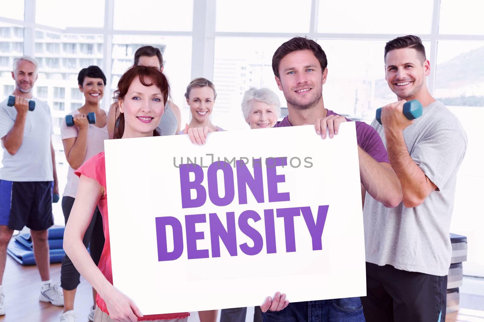 Couple holding a white sign against bone density