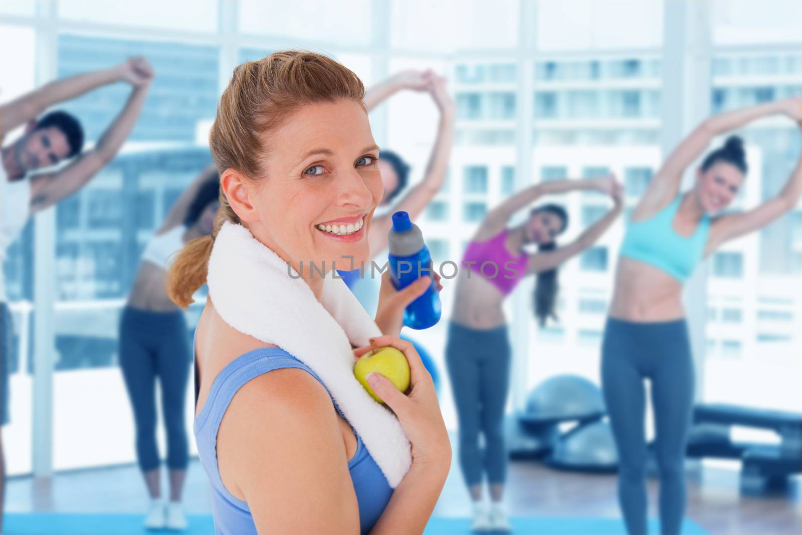 Composite image of fit woman smiling at camera