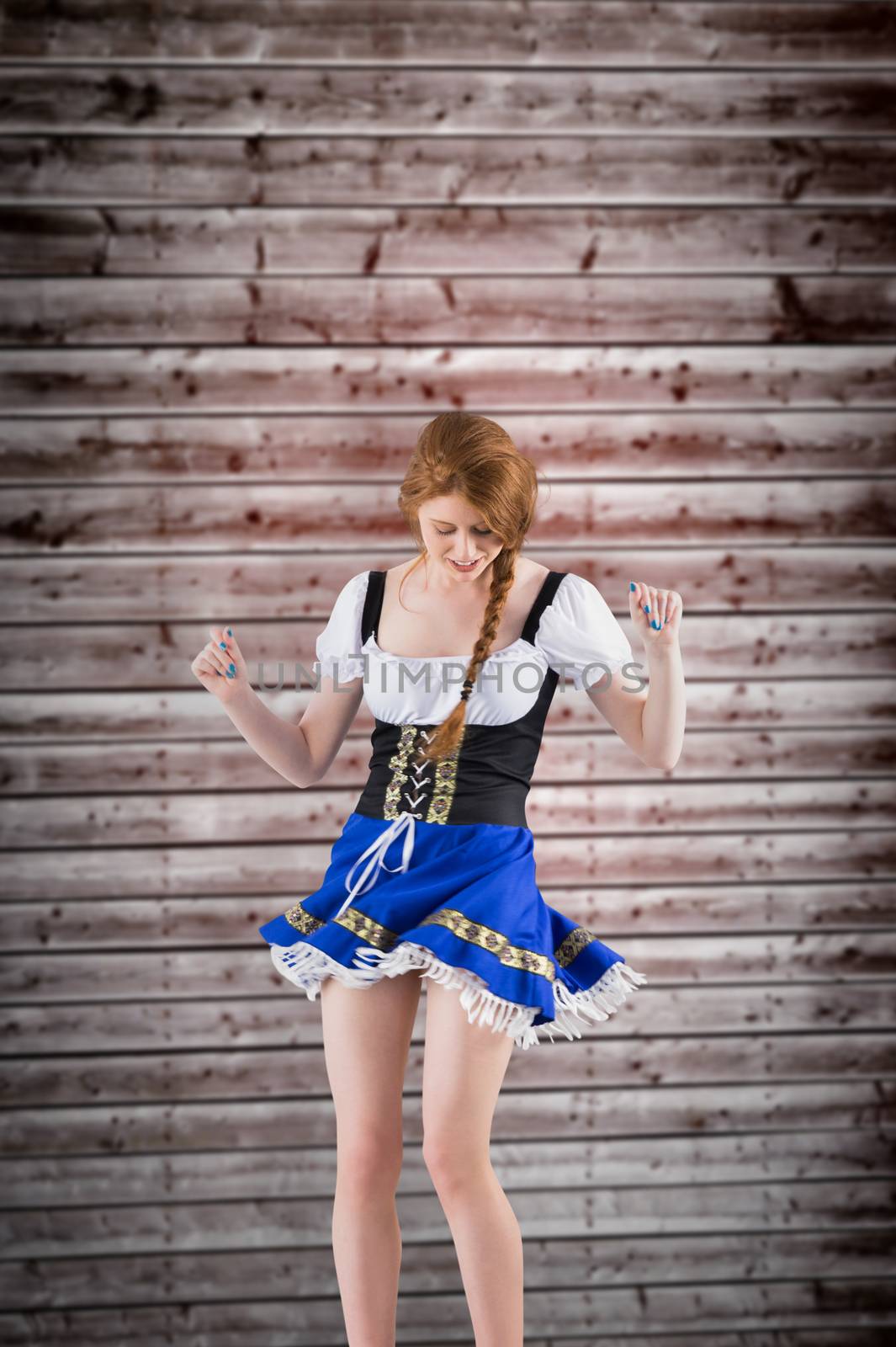 Composite image of oktoberfest girl moving and dancing by Wavebreakmedia