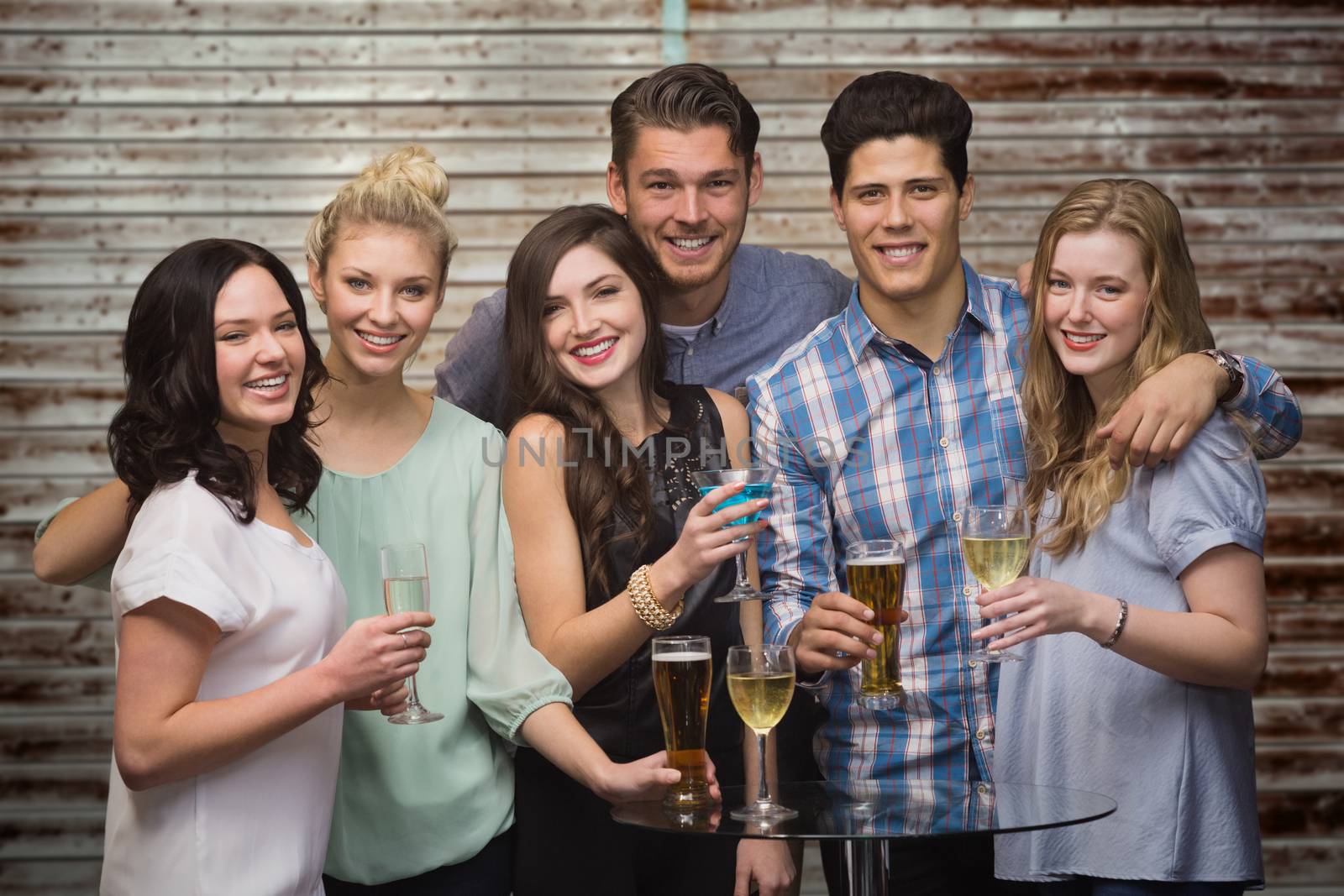 Composite image of friends with drinks by Wavebreakmedia