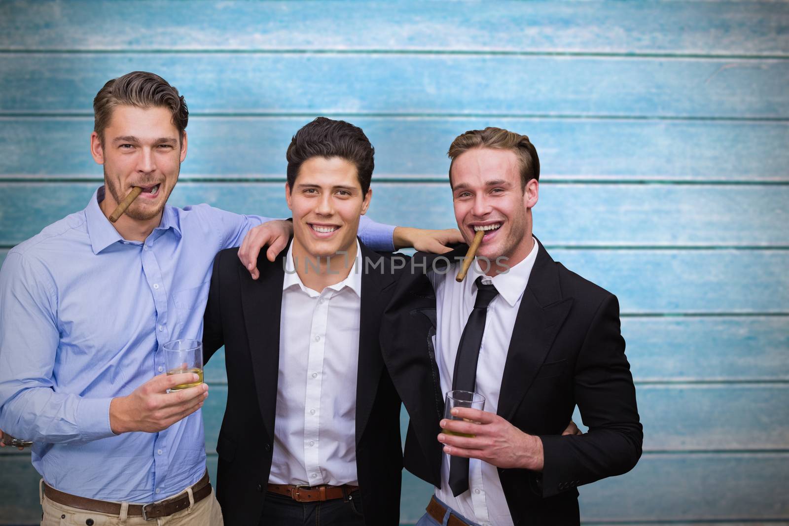 Composite image of handsome friends having a drink together by Wavebreakmedia
