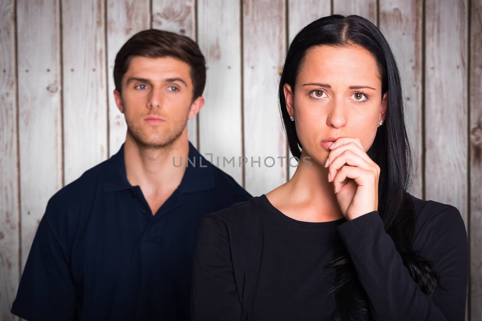 Composite image of couple not talking after argument by Wavebreakmedia