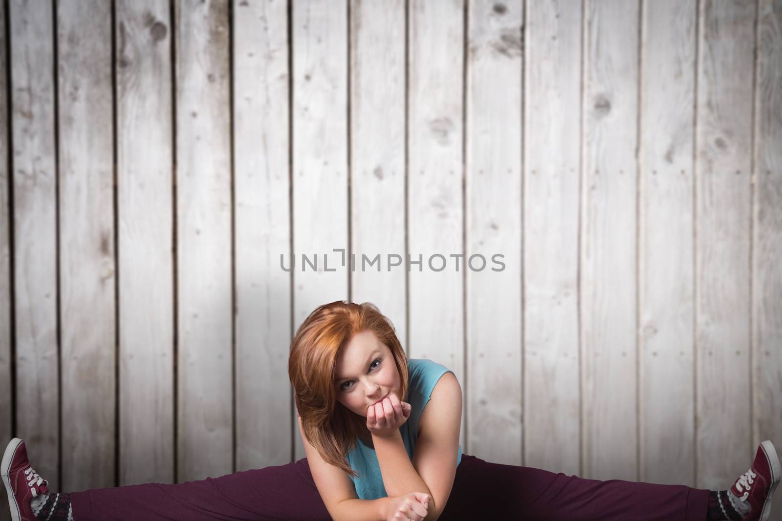 Pretty break dancer against wooden planks