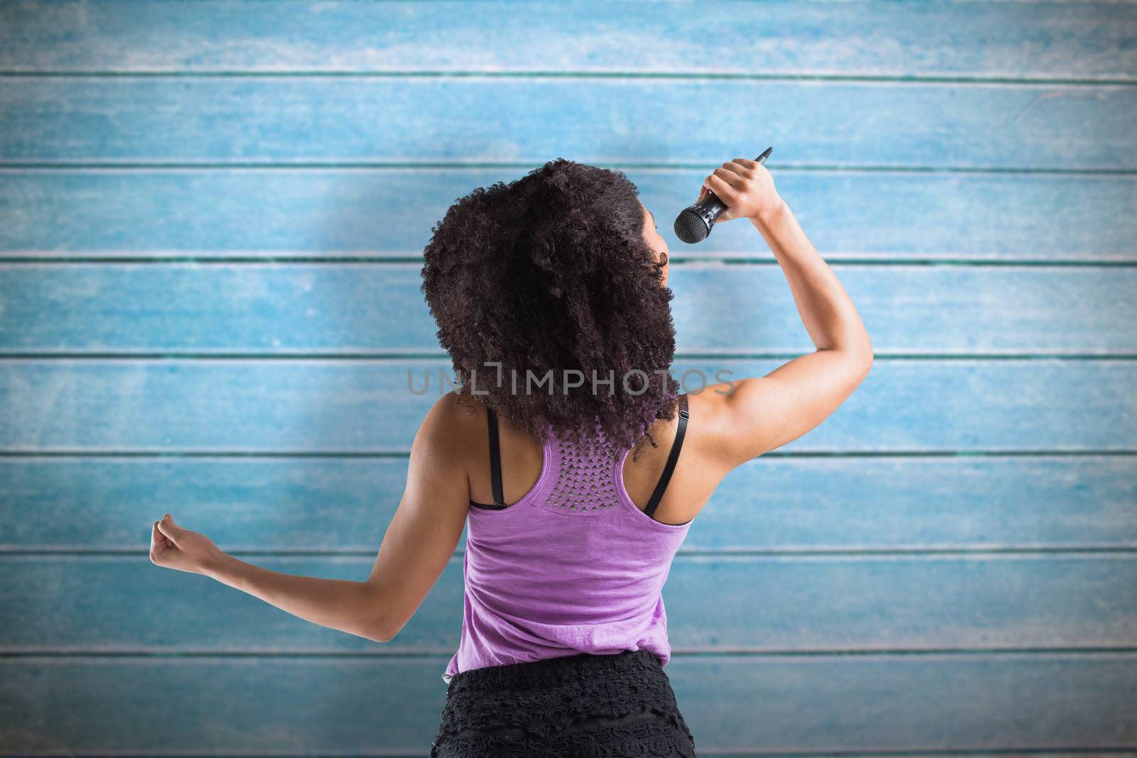 Composite image of pretty girl singing by Wavebreakmedia