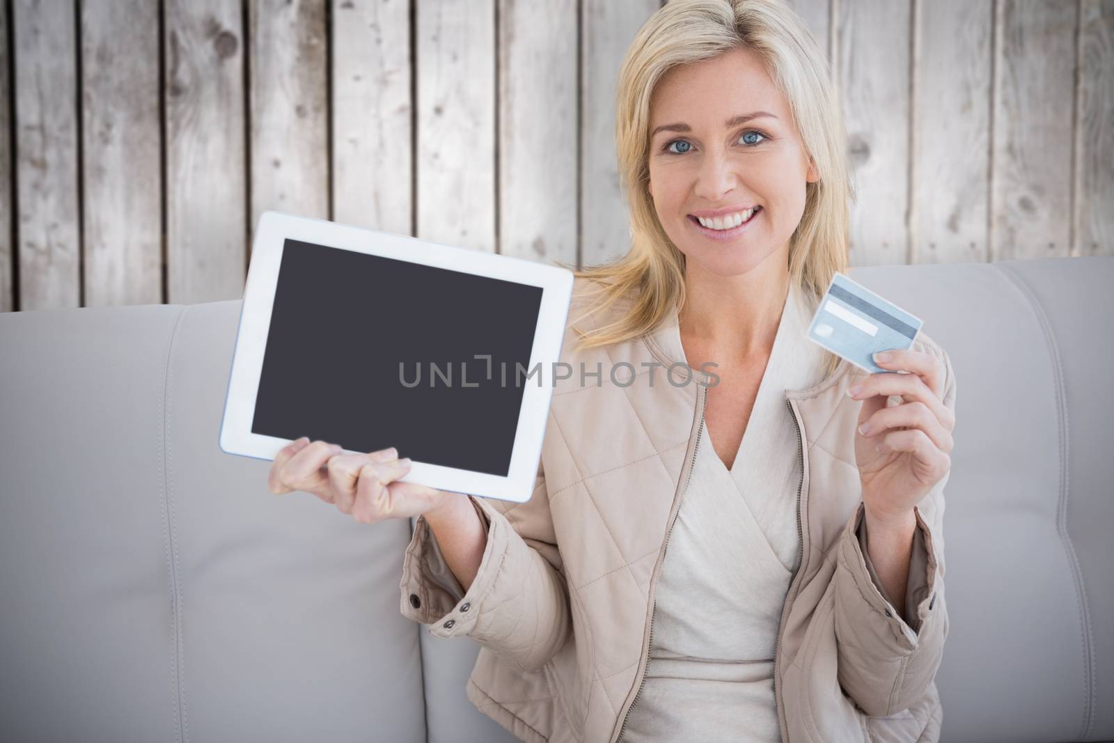 Woman shopping online against wooden planks