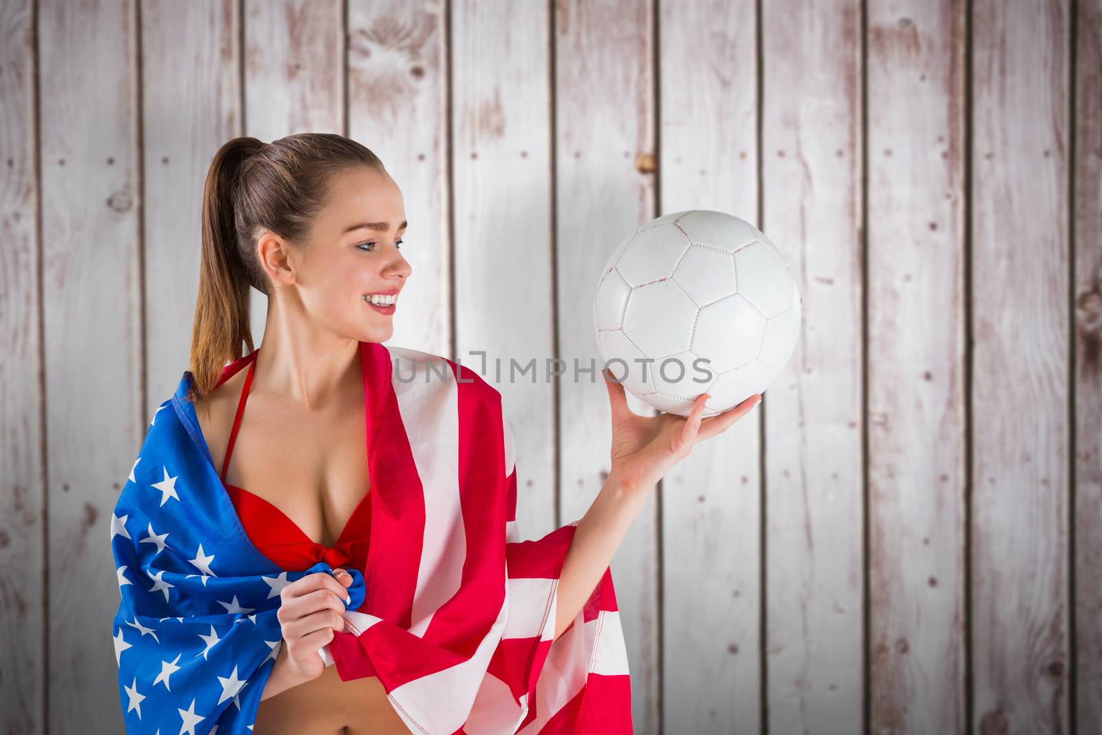 Composite image of pretty girl in bikini with american flag by Wavebreakmedia