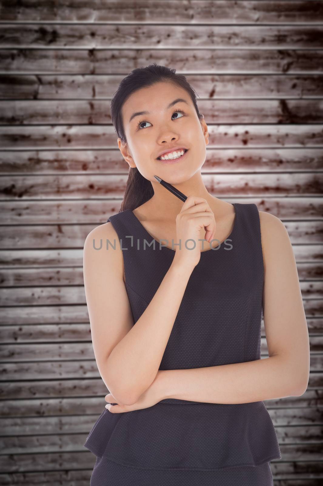 Composite image of thinking businesswoman by Wavebreakmedia