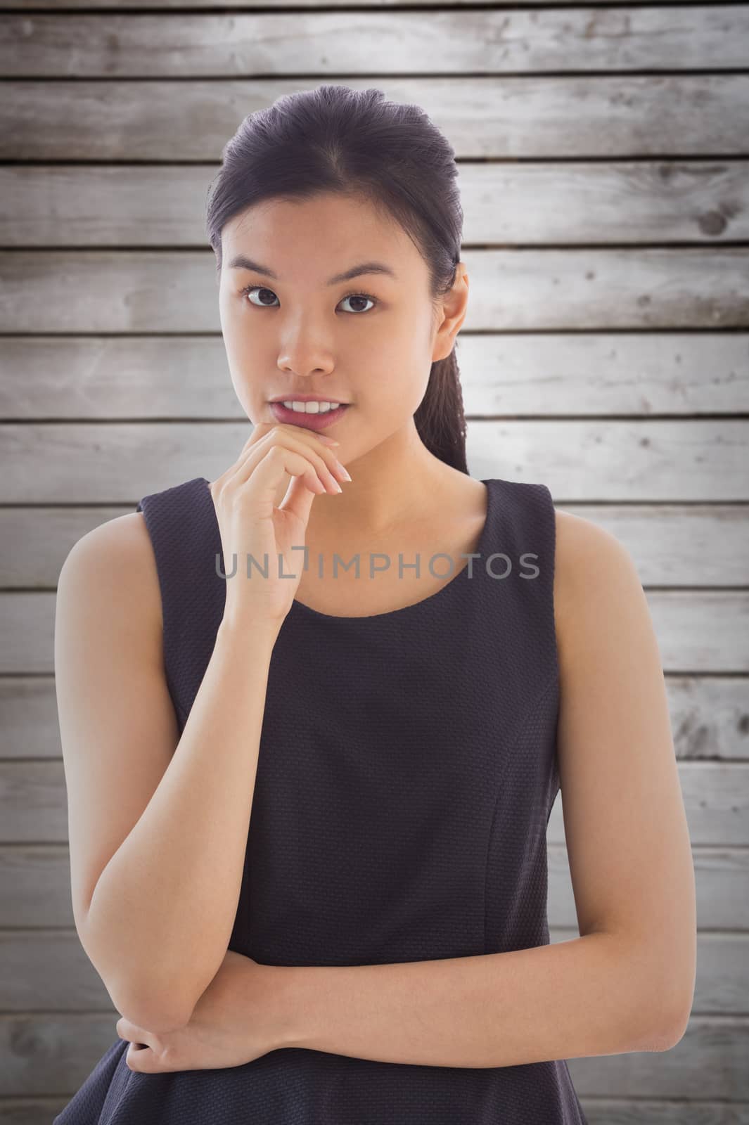 Composite image of thoughtful asian businesswoman by Wavebreakmedia