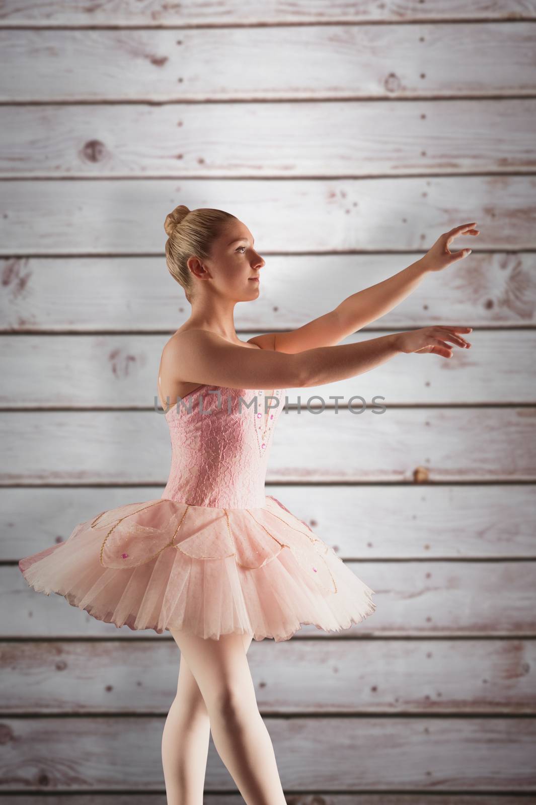 Composite image of pretty ballerina in pink  by Wavebreakmedia