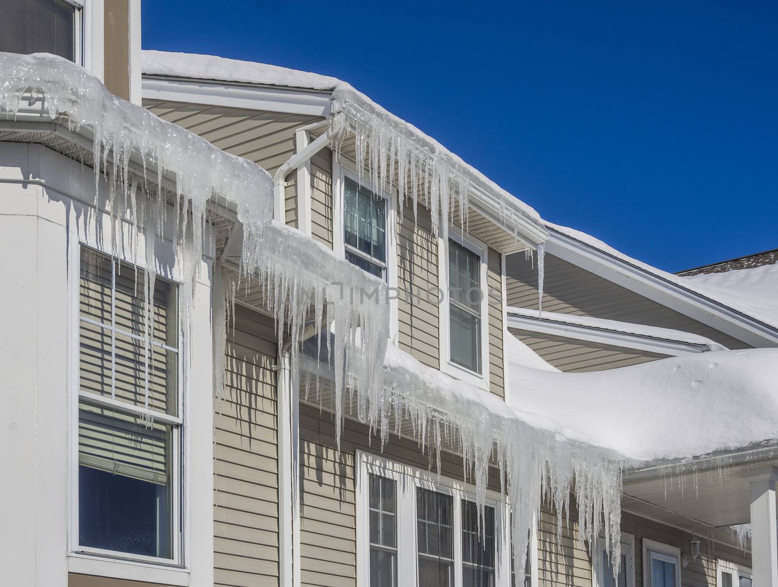 Ice dams and snow on roof and gutters by f/2sumicron