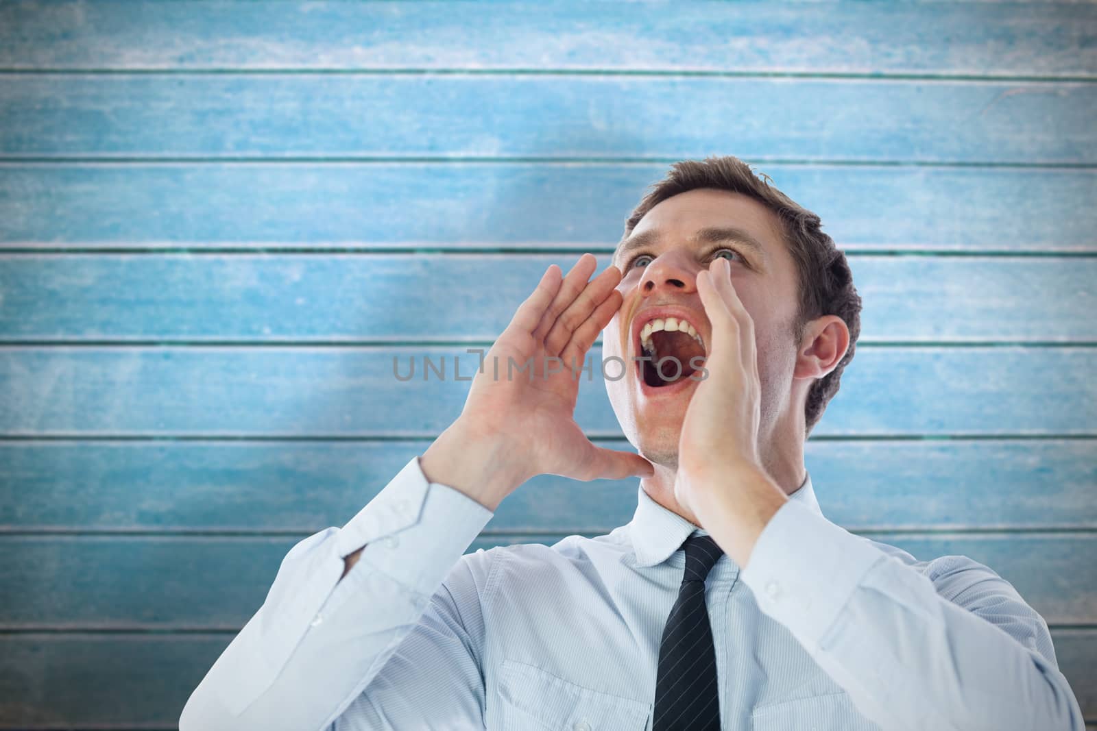 Businessman shouting against wooden planks