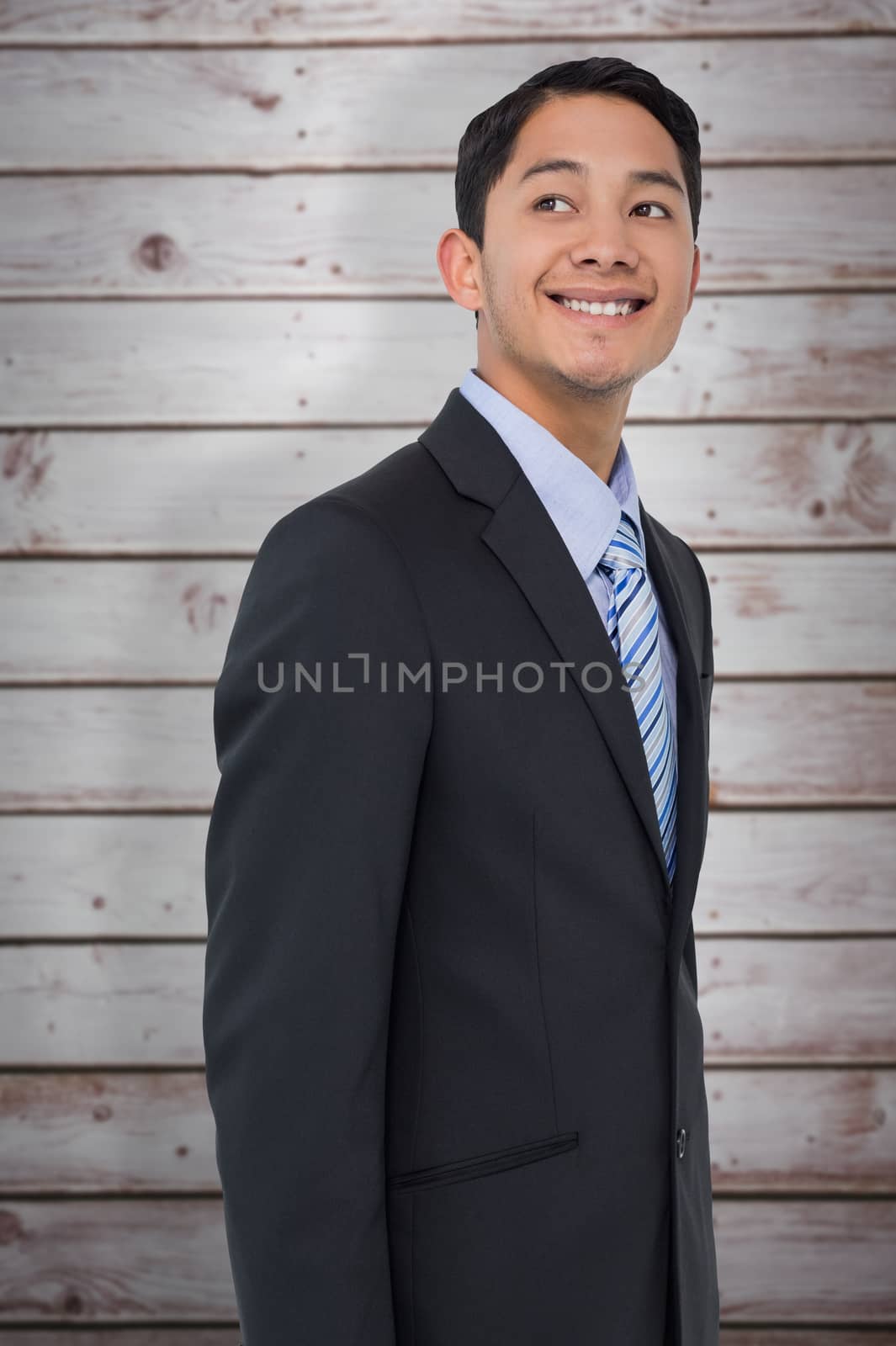 Composite image of smiling asian businessman  by Wavebreakmedia