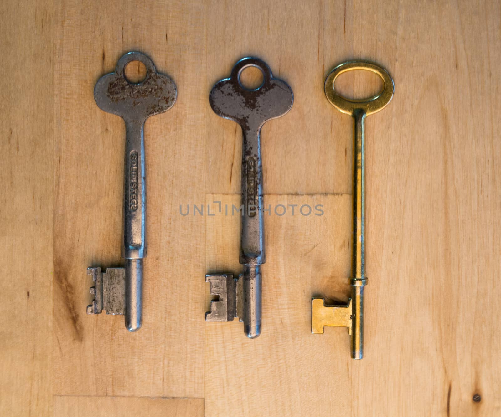Three different keys on wood by wit_gorski