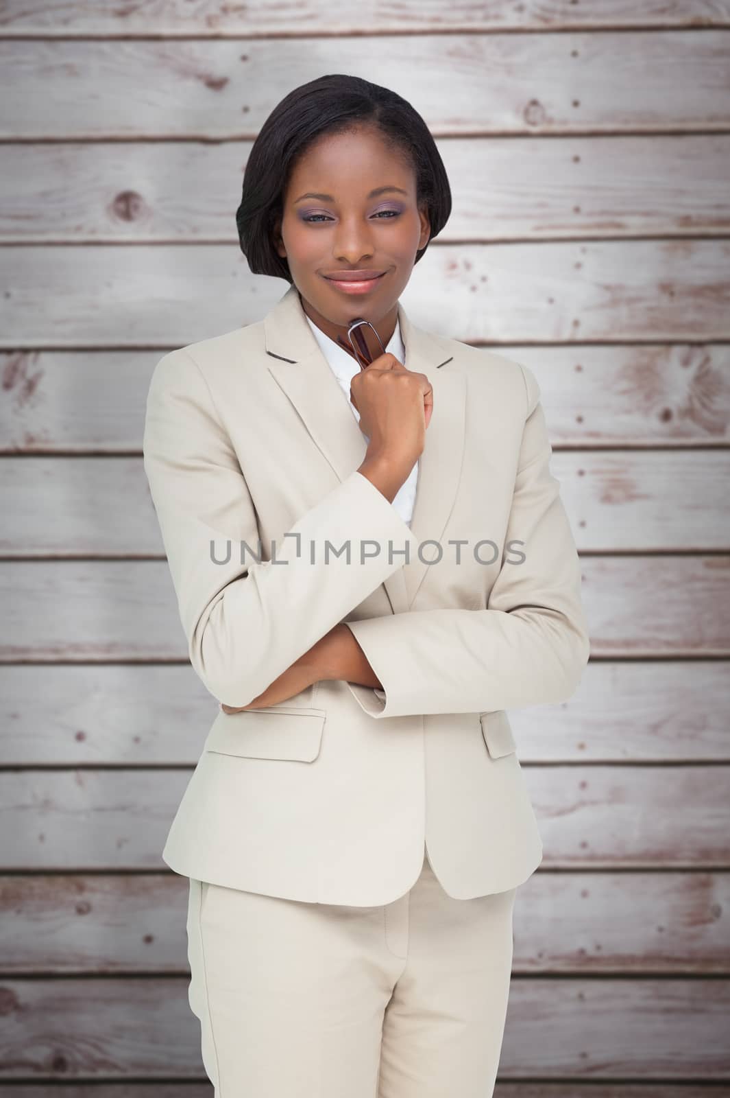 Thinking businesswoman against wooden planks