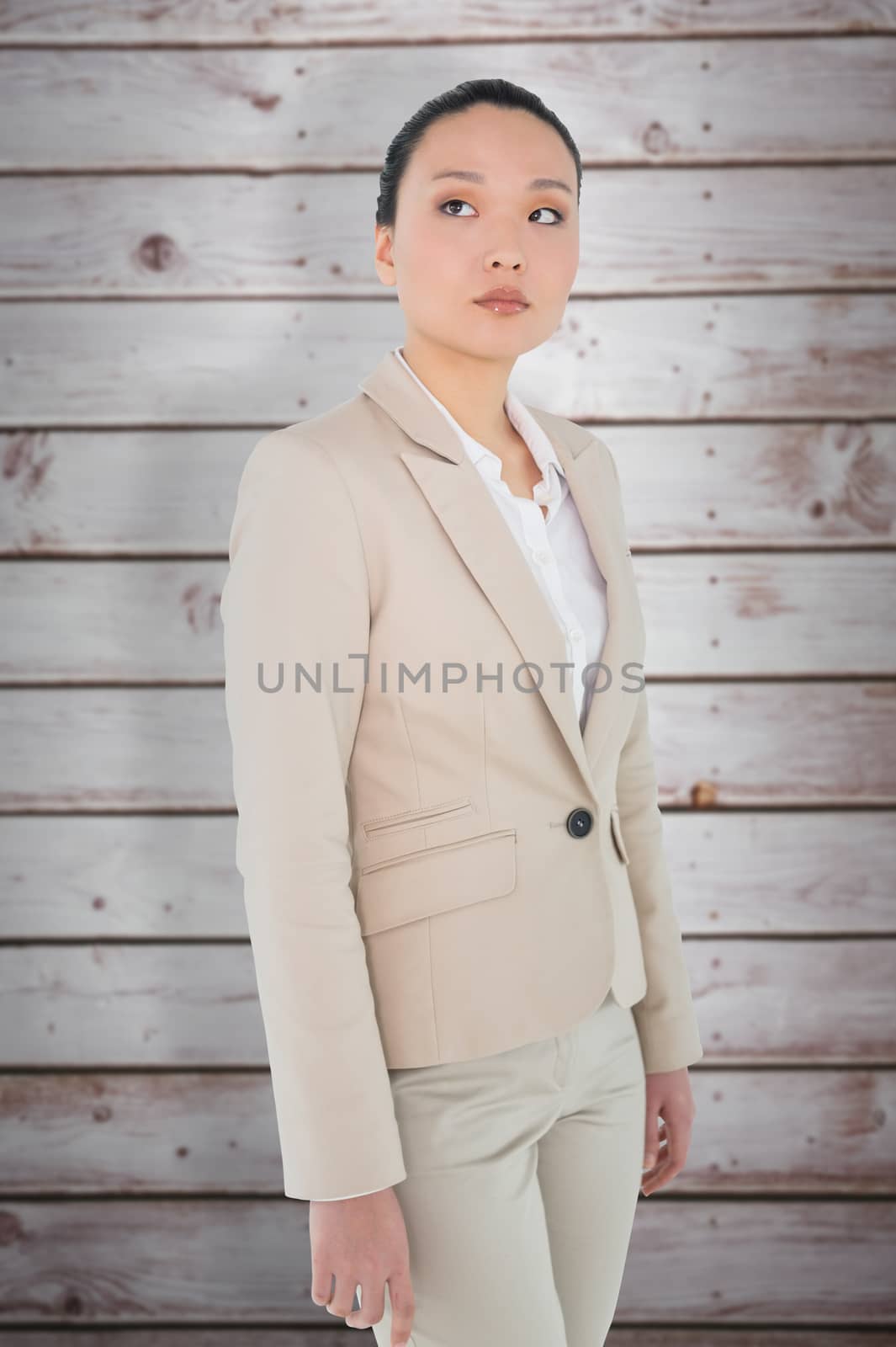 Composite image of unsmiling asian businesswoman by Wavebreakmedia