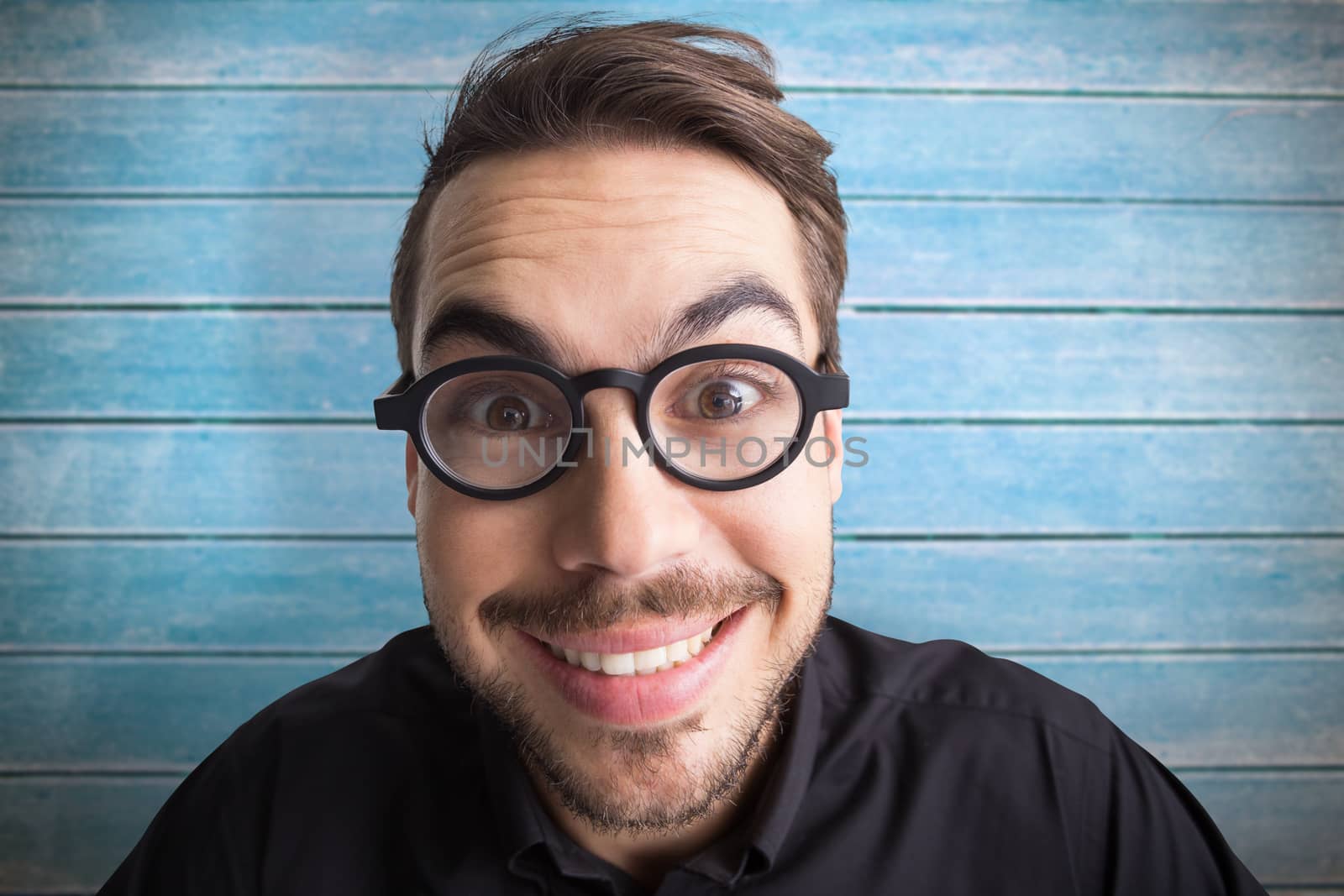 Composite image of portrait of a smiling businessman with glasses by Wavebreakmedia