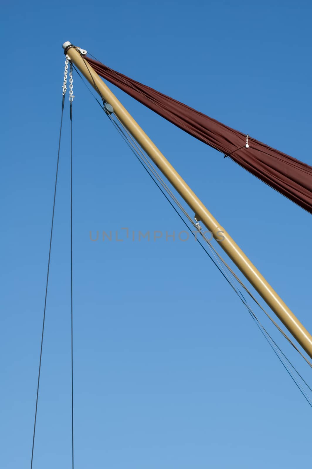 rigging abstract on a sailboat against a clear blue sky