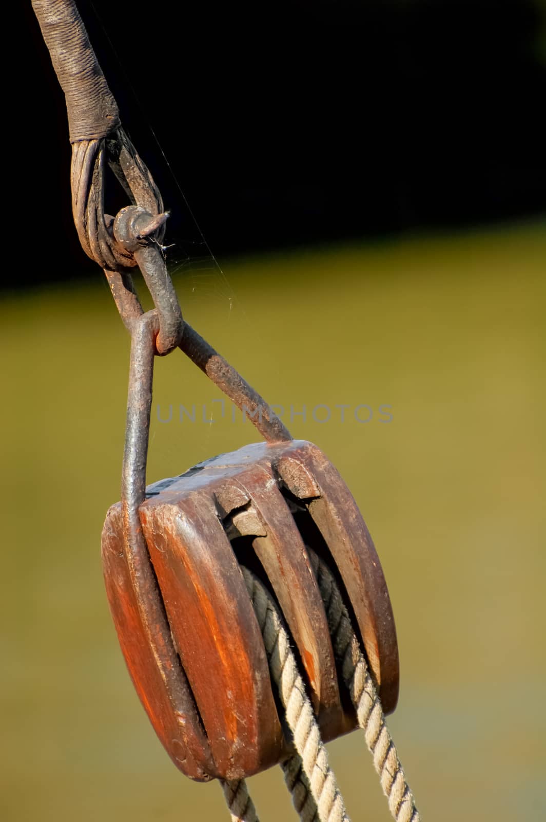 antique block and tackle lifting equipment on an old sailboat