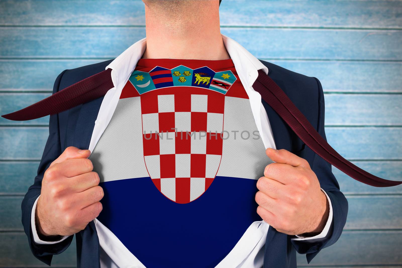 Businessman opening shirt to reveal croatia flag against wooden planks