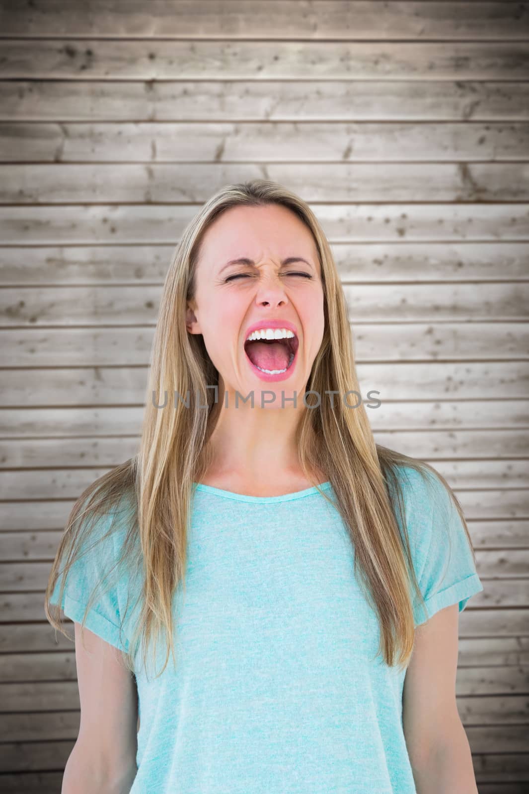 Composite image of furious blonde standing and screaming by Wavebreakmedia