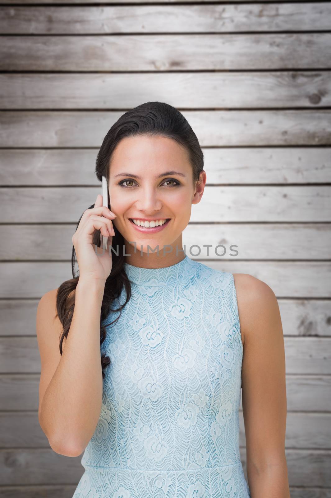 Composite image of brunette on the phone by Wavebreakmedia
