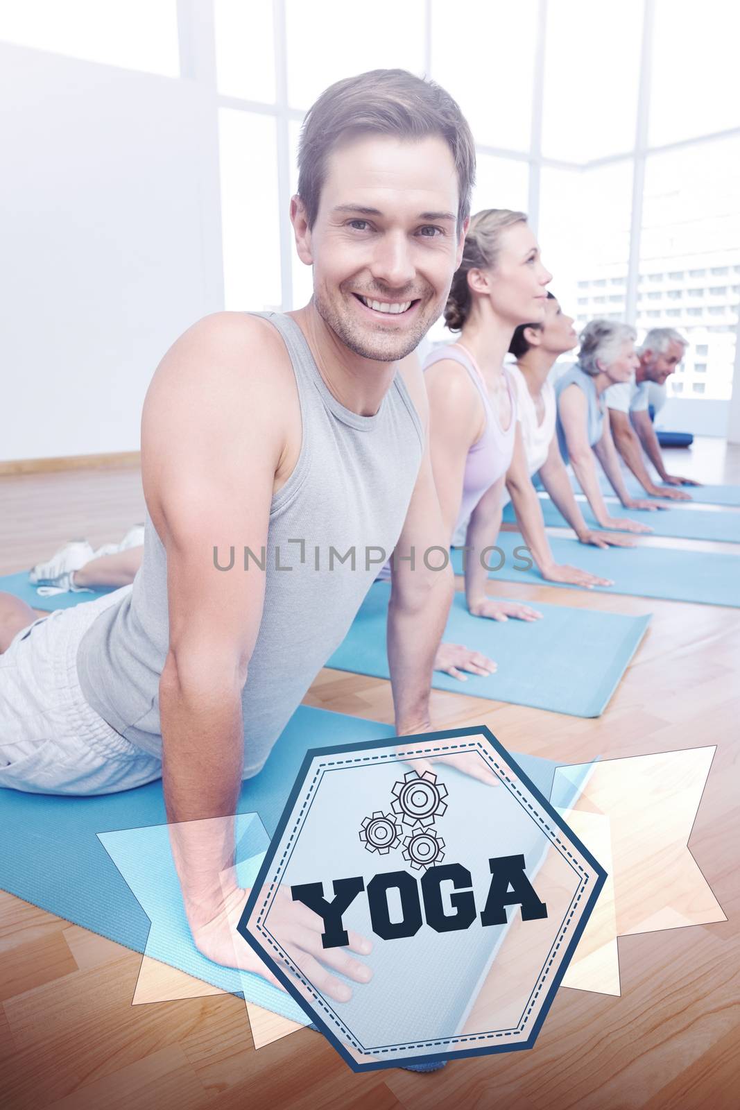 The word yoga and froup doing cobra pose in row at yoga class against hexagon