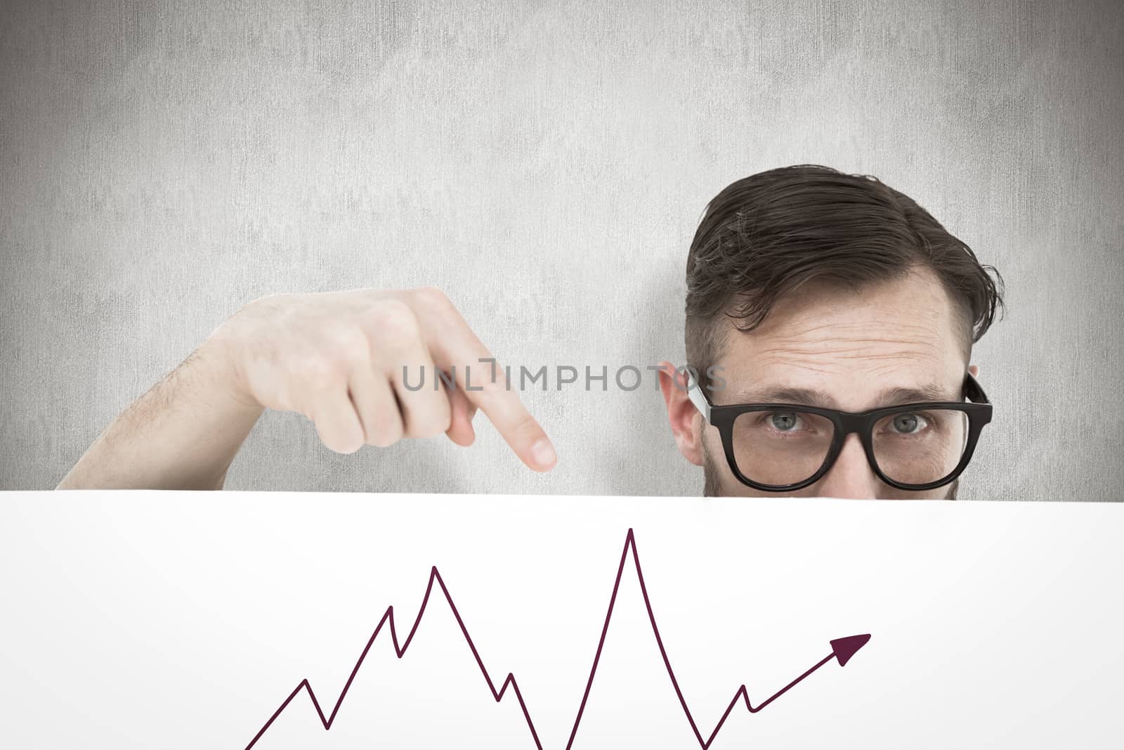 Geeky young hipster showing poster against white background