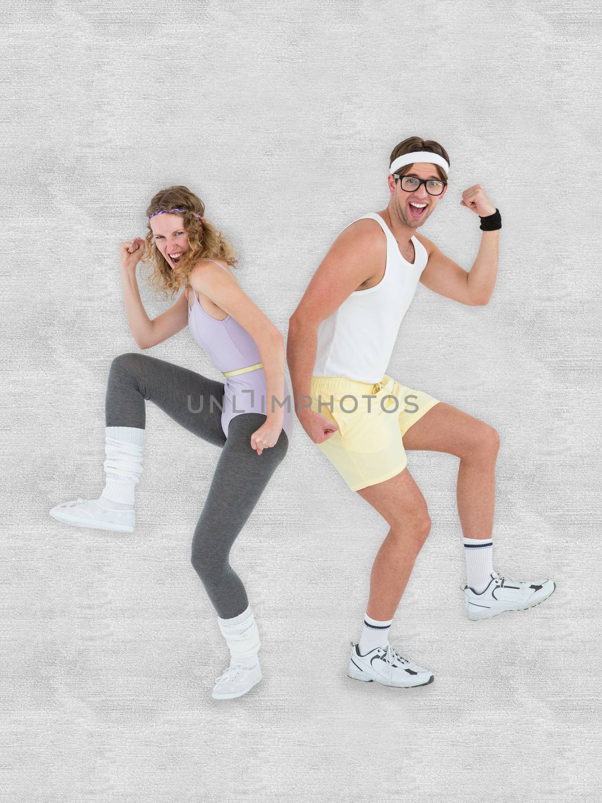 Geeky hipster couple posing in sportswear against white background