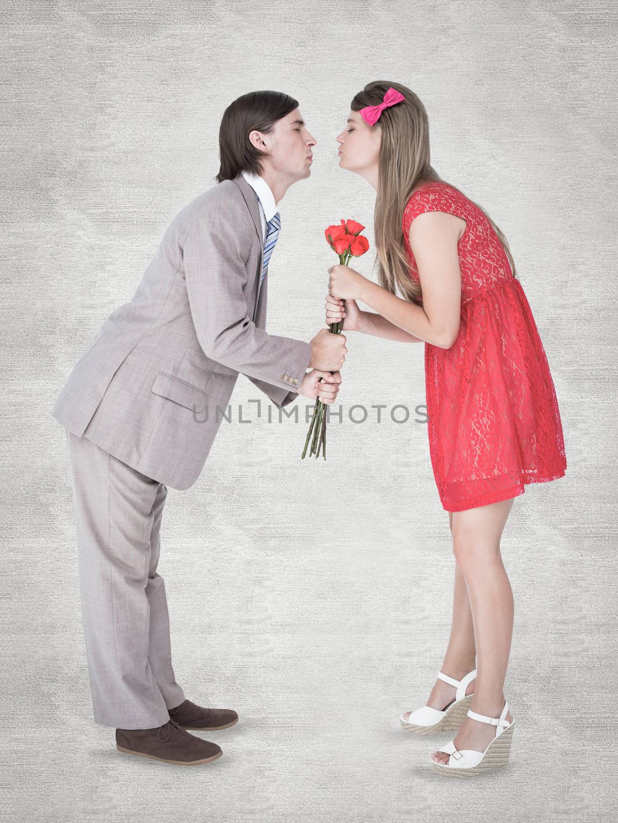Cute geeky couple kissing against white background
