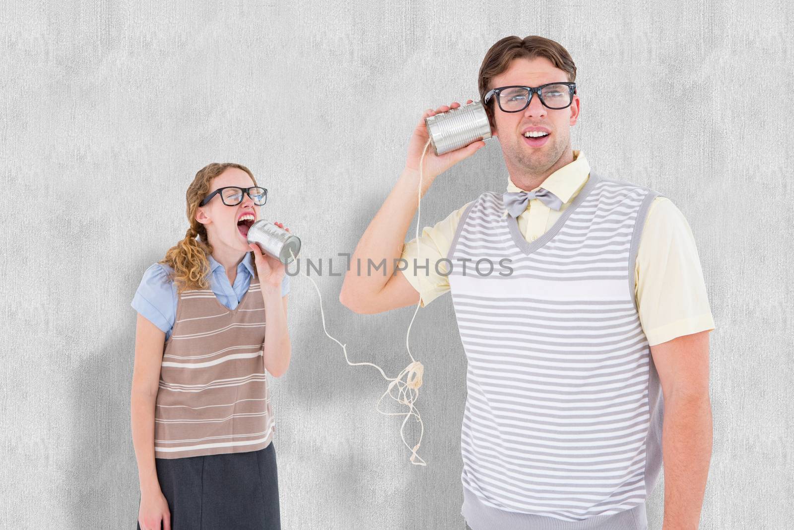 Composite image of geeky hipster couple speaking with tin can phone  by Wavebreakmedia