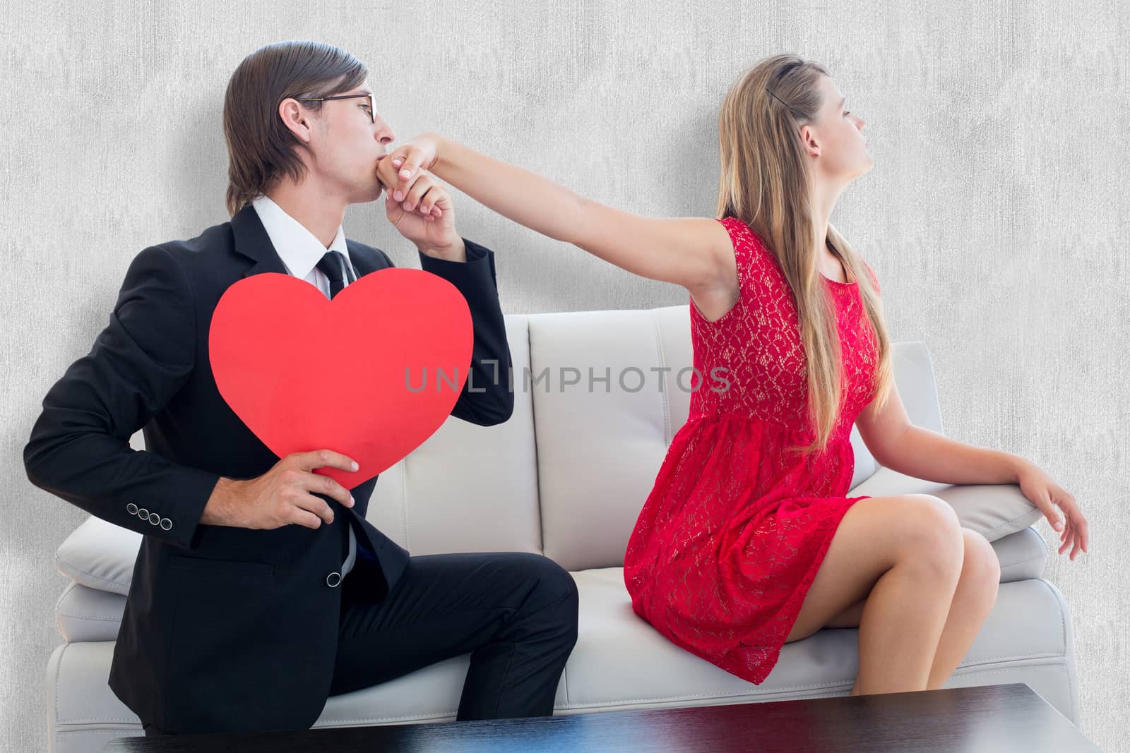 Cute geeky couple with red heart shape against white background