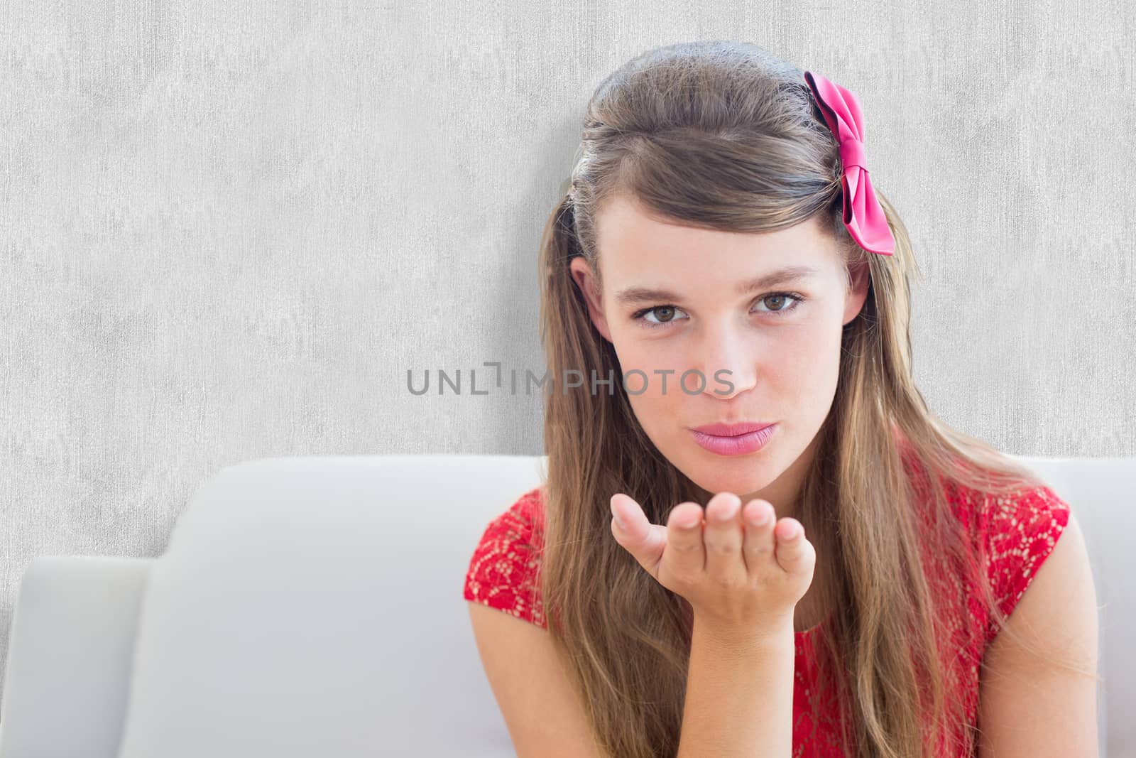 Pretty smiling hipster looking at camera against white background