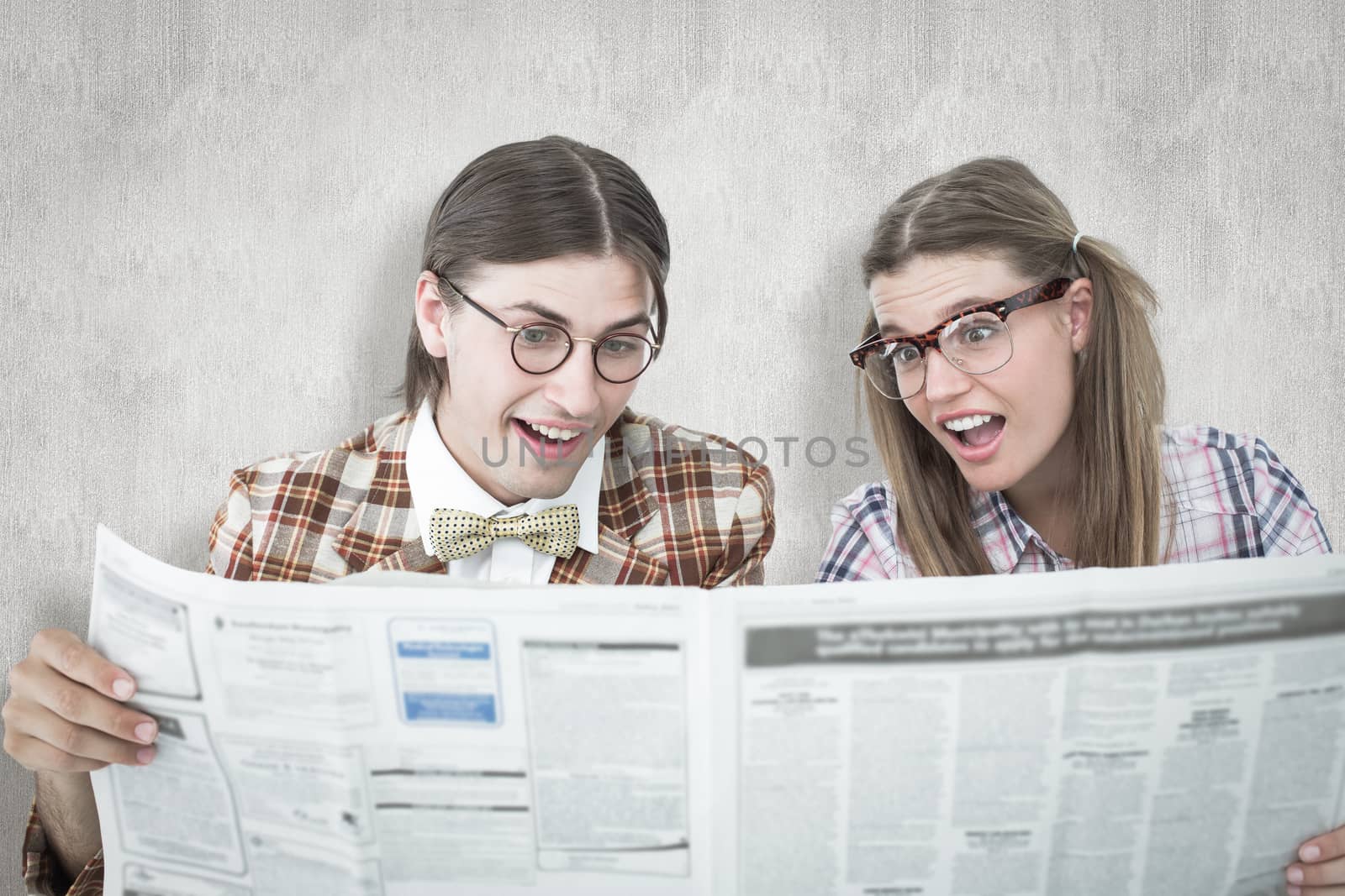 Composite image of geeky hipsters reading the newspaper by Wavebreakmedia