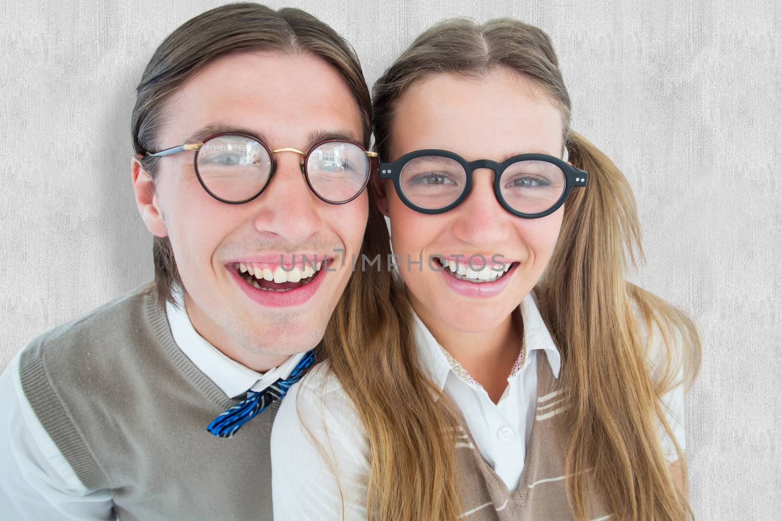 Geeky hipsters smiling at camera  against white background