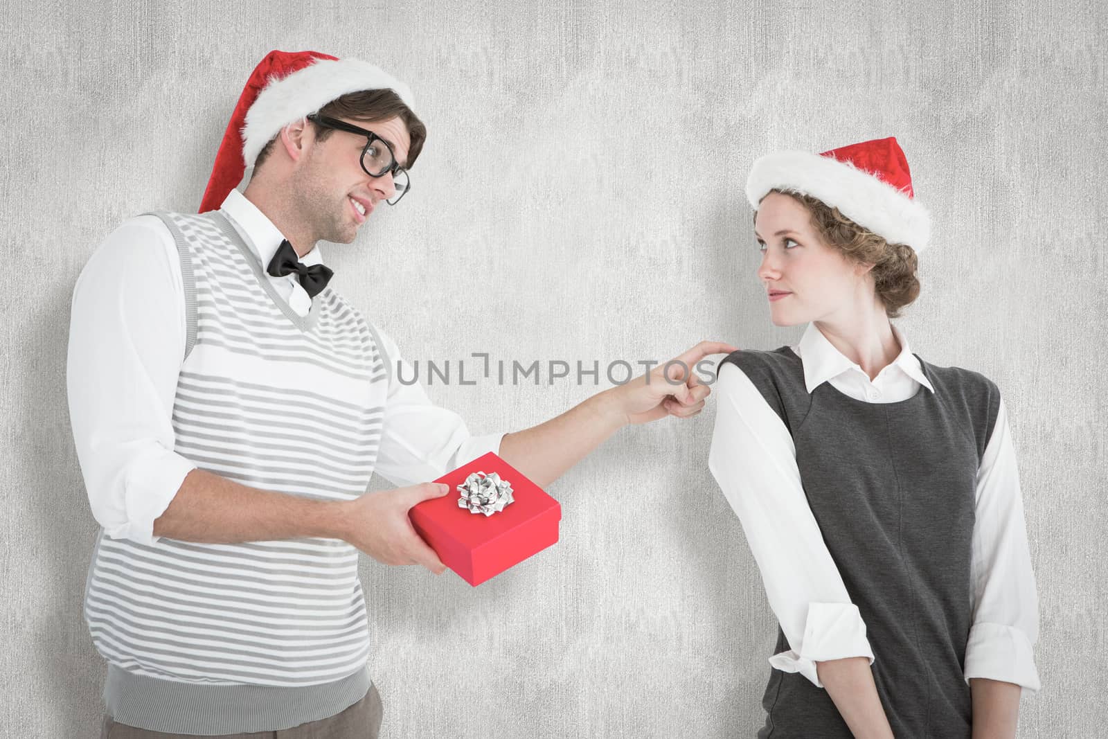 Composite image of geeky hipster offering present to his girlfriend by Wavebreakmedia