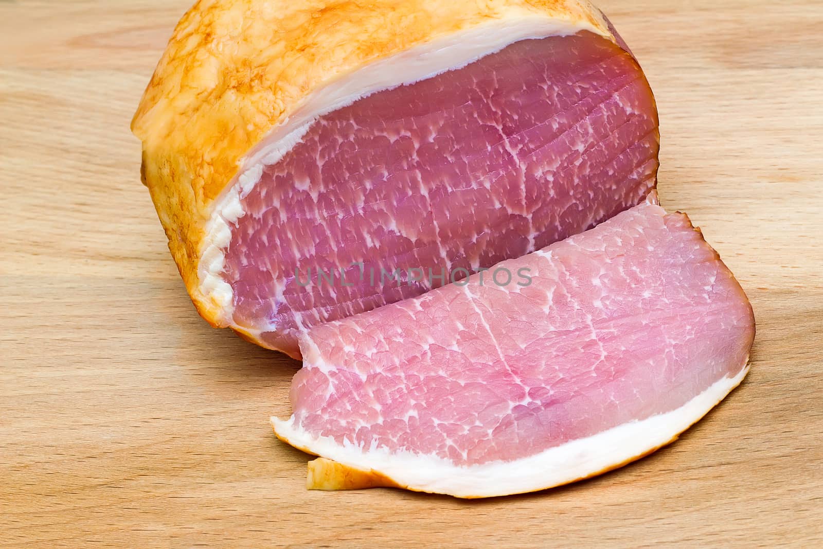 A large piece of delicious ham on the table surface