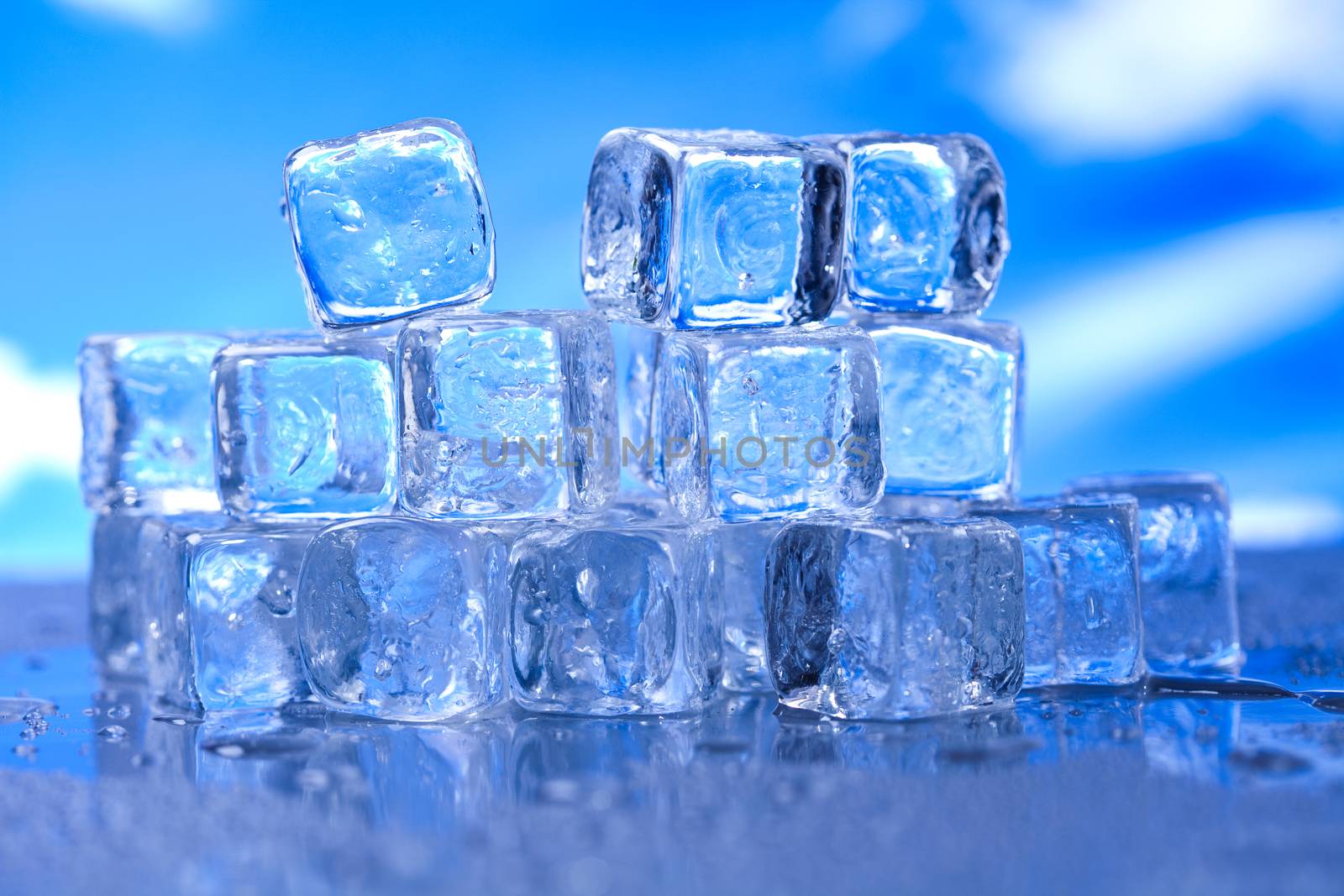 Ice cubes on blue background