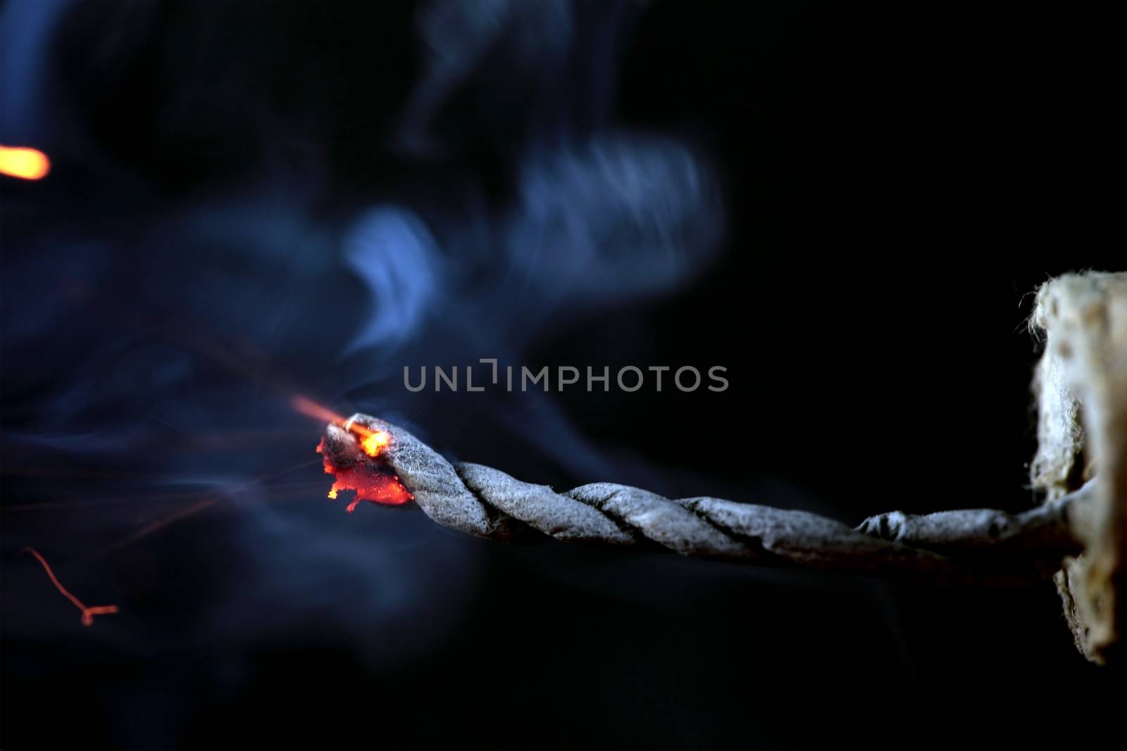 Burning fuse of a firecracker.