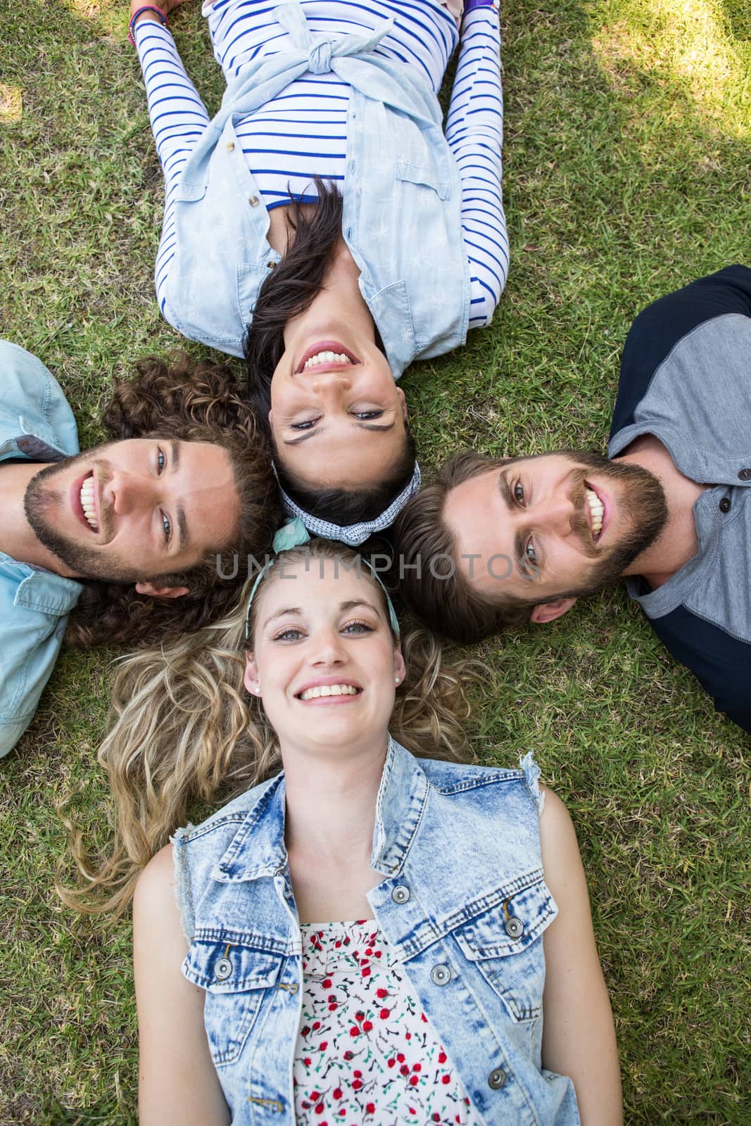 Happy friends smiling at camera by Wavebreakmedia